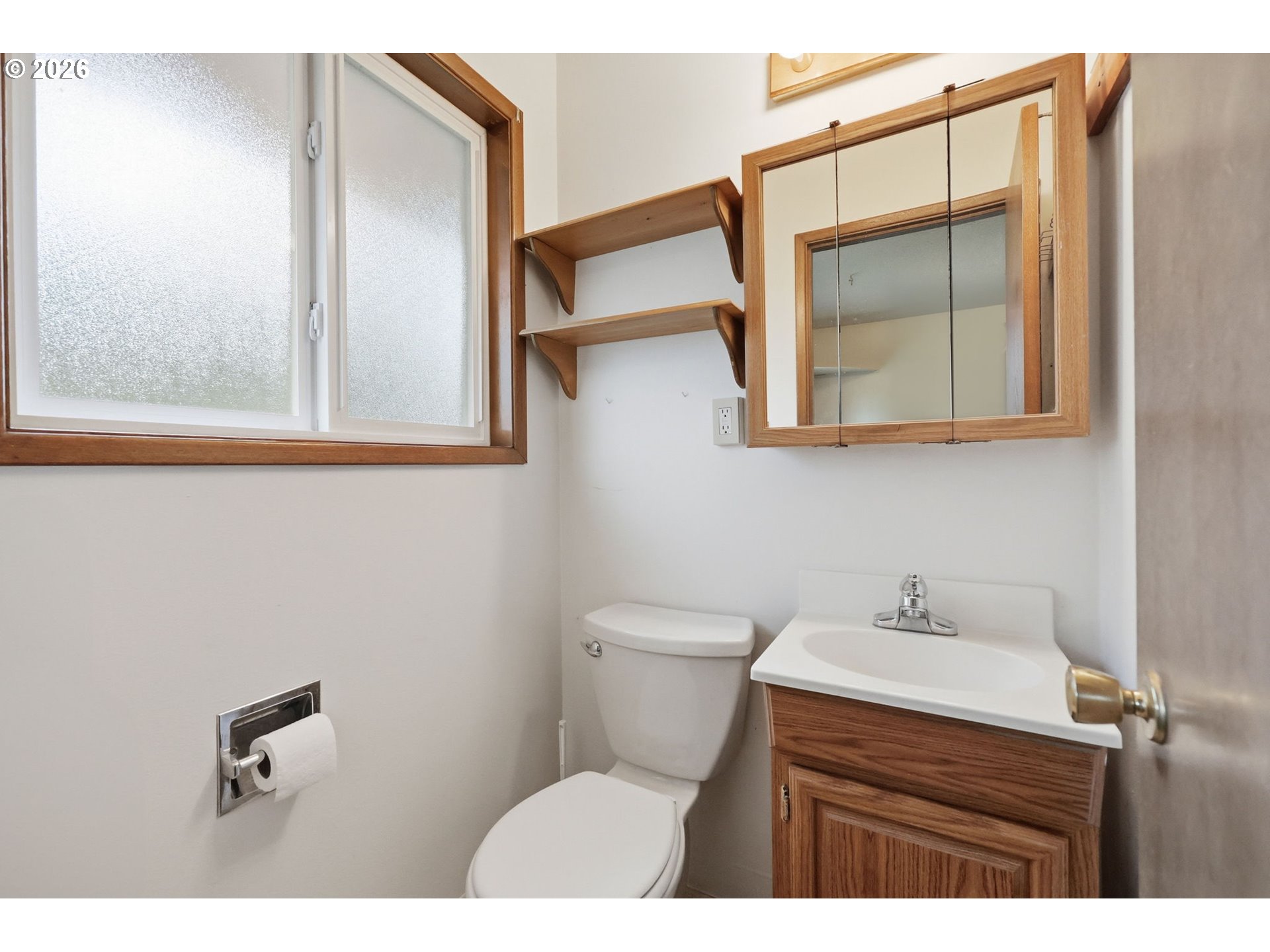 18925 Southwest Rosa Road Beaverton, OR 97078 - Photo 12 of 33 a bathroom with a sink a mirror and a toilet