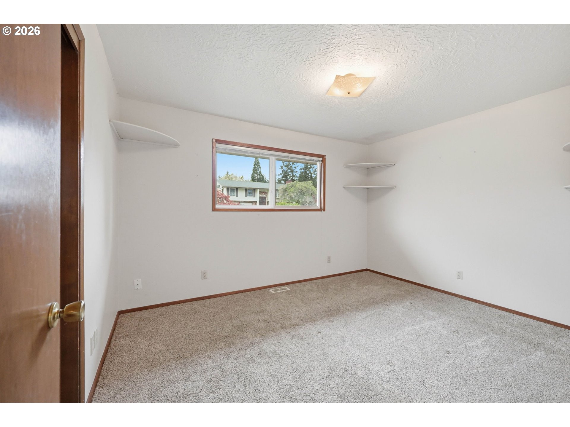 18925 Southwest Rosa Road Beaverton, OR 97078 - Photo 14 of 33 a view of an empty room with a window