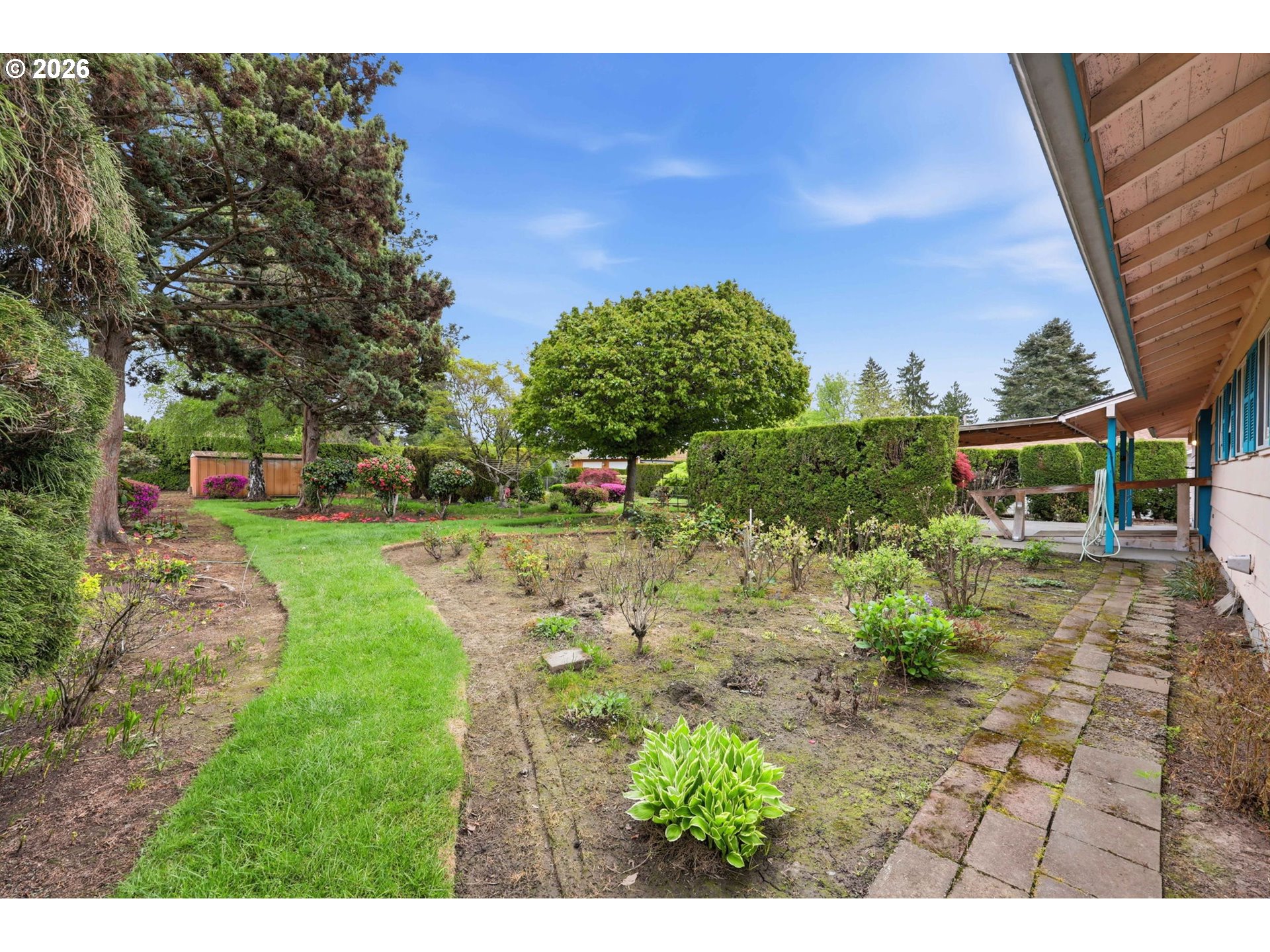18925 Southwest Rosa Road Beaverton, OR 97078 - Photo 20 of 33 a backyard of a house with lots of green space