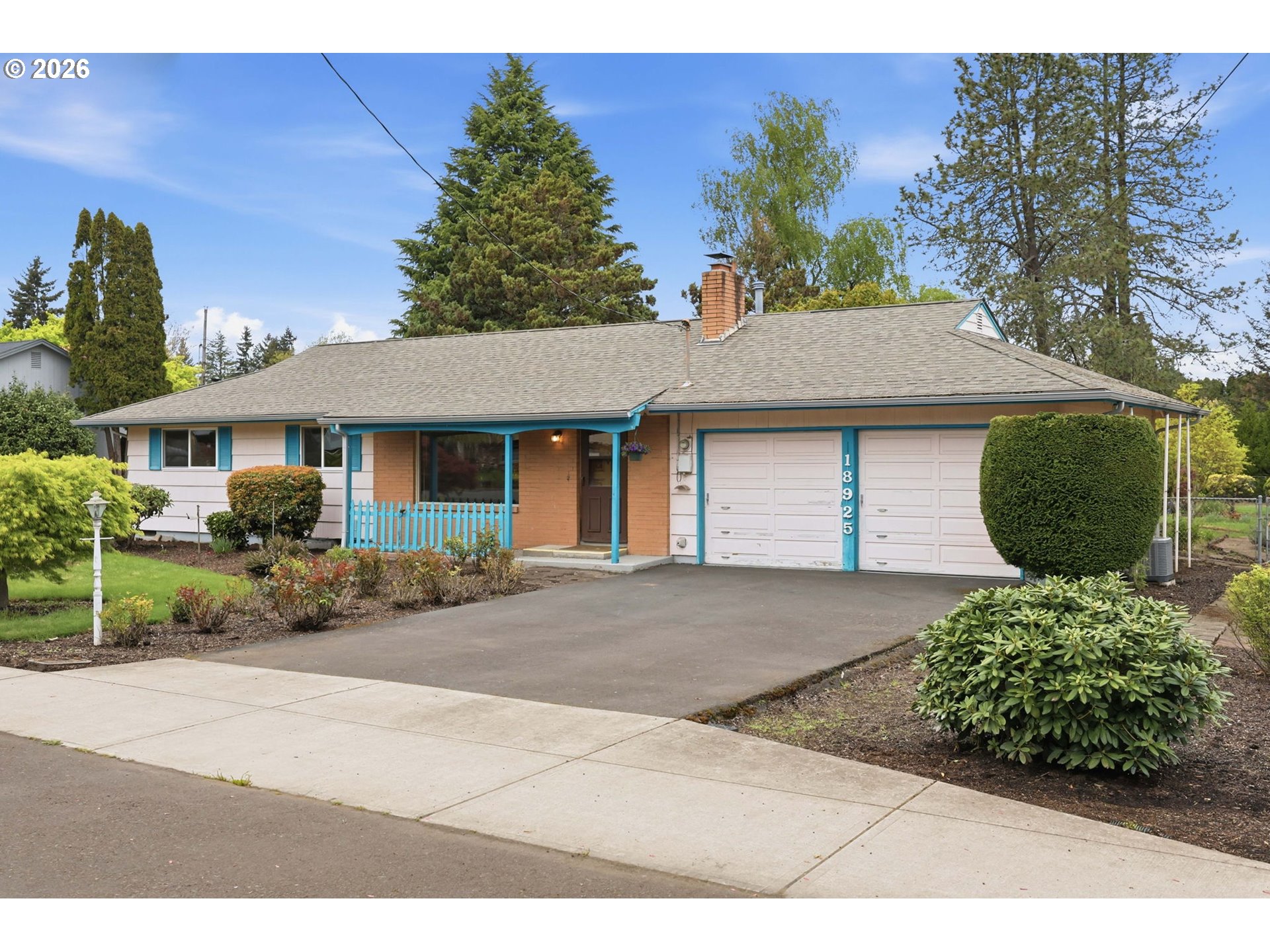 18925 Southwest Rosa Road Beaverton, OR 97078 - Photo 29 of 33 a front view of a house with a garden and outdoor seating
