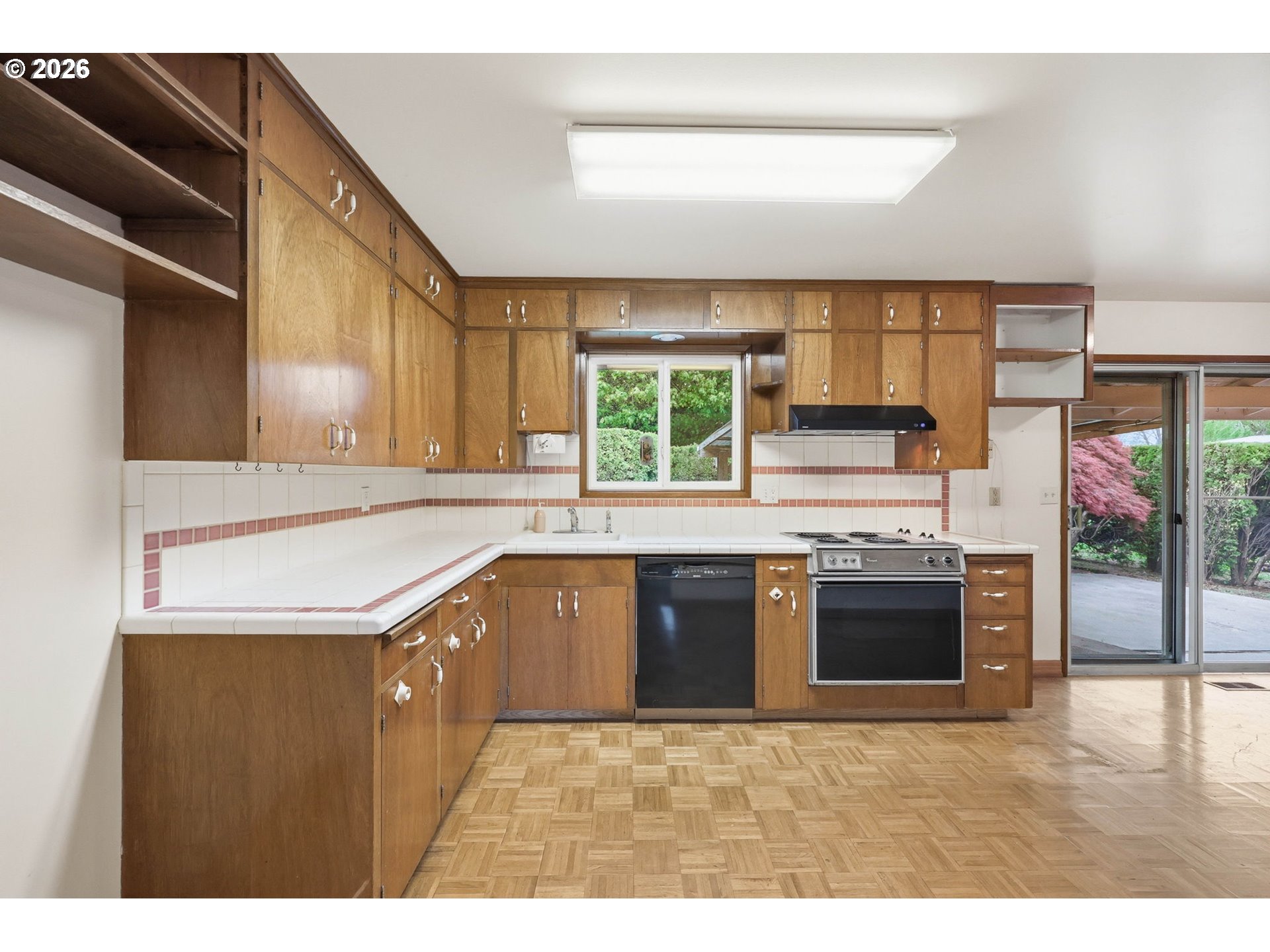 18925 Southwest Rosa Road Beaverton, OR 97078 - Photo 3 of 33 a kitchen with stainless steel appliances granite countertop a sink a stove and a refrigerator