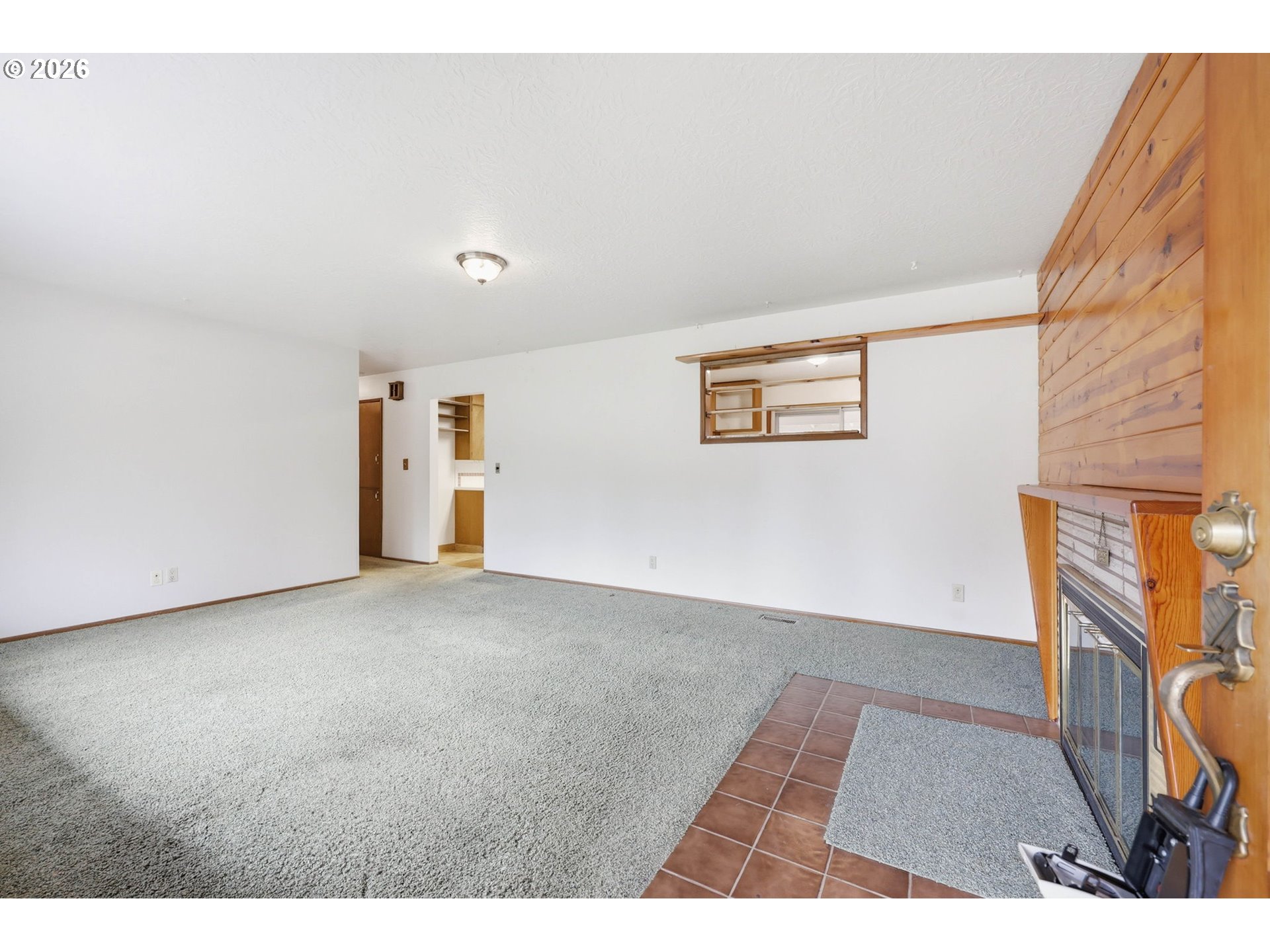 18925 Southwest Rosa Road Beaverton, OR 97078 - Photo 6 of 33 a view of an empty room with wooden floor