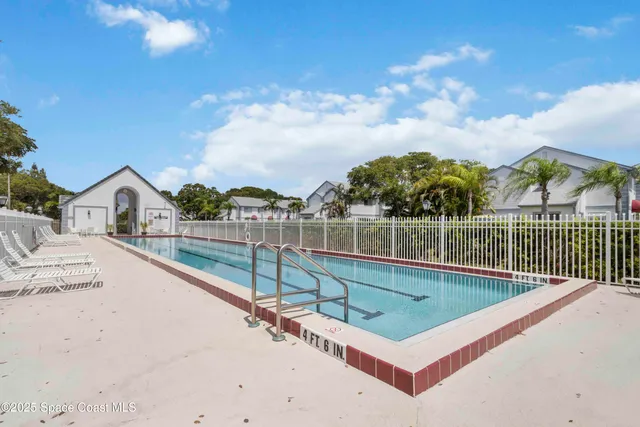 a view of a balcony with floor to ceiling windows