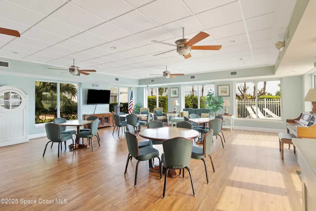 a green field with some trees in the background
