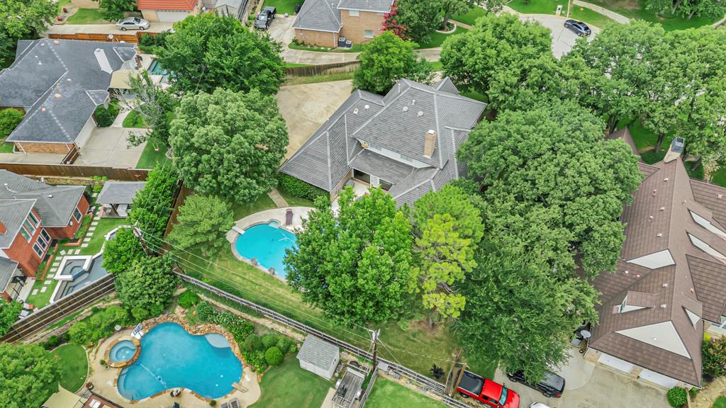 4008 Ramsgate Court Colleyville, TX 76034 - Photo 33 of 33 Expansive lot featuring a large residence with a multi-gabled roofline, mature trees, and a private swimming pool with an integrated spa