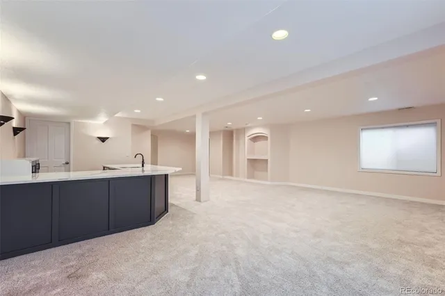 a view of kitchen and kitchen with sink