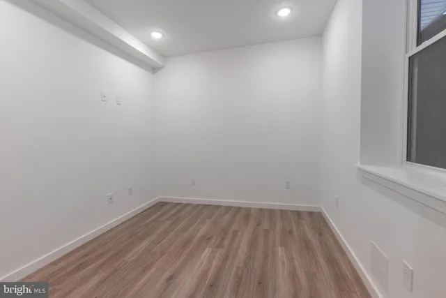 a bathroom with a sink mirror vanity and toilet