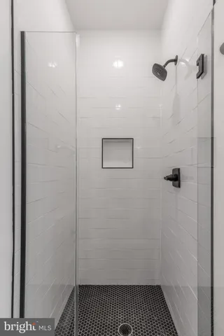 a bathroom with a shower and a toilet