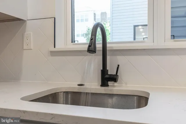 a bathroom with a toilet and a bathtub