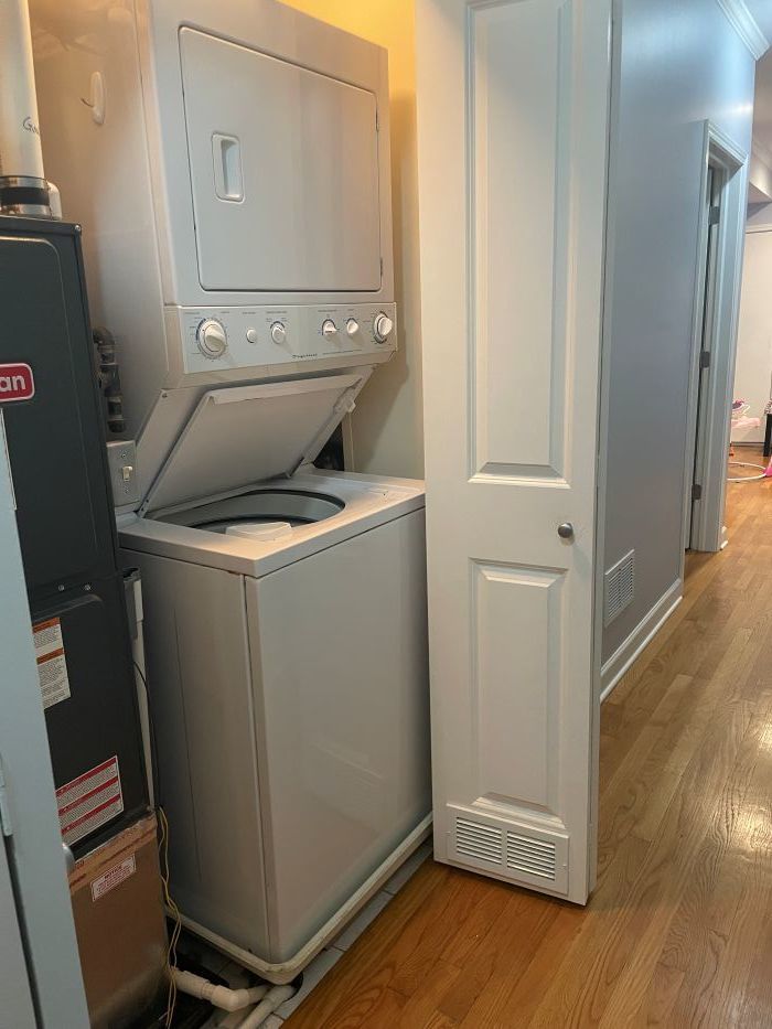 3707 North Kenneth Avenue, Unit 216 Chicago, IL 60641 - Photo 11 of 14 a utility room with dryer and washer