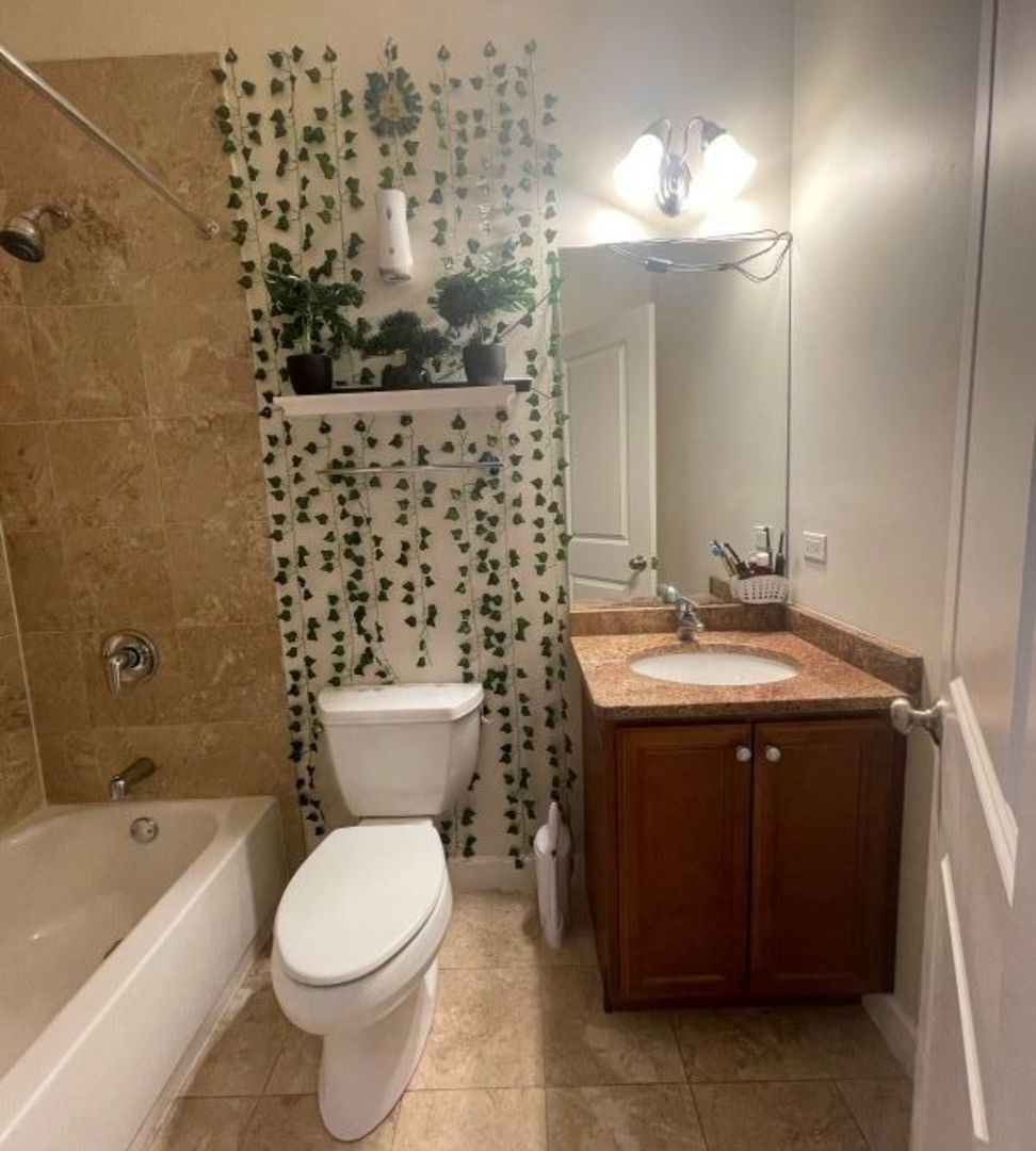 3707 North Kenneth Avenue, Unit 216 Chicago, IL 60641 - Photo 7 of 14 a bathroom with a sink toilet and shower
