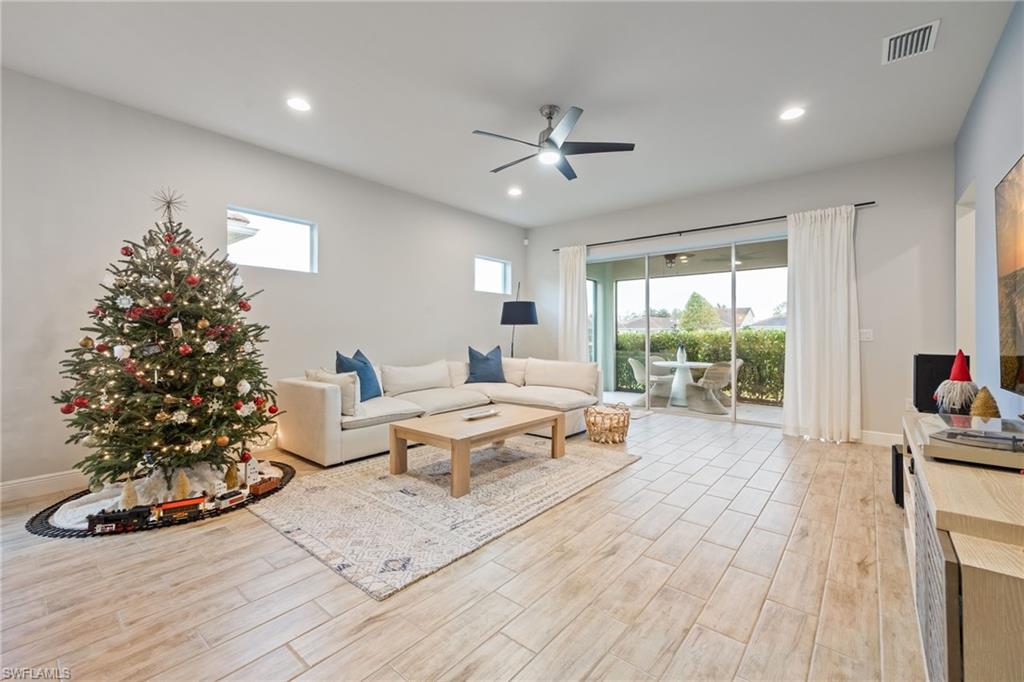 3509 Pilot Circle Naples, FL 34120 - Photo 17 of 50 a living room with furniture windows and a potted plant