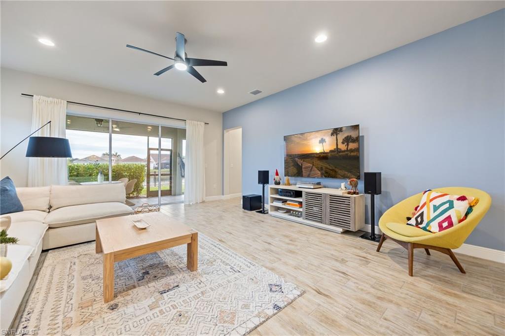 3509 Pilot Circle Naples, FL 34120 - Photo 18 of 50 a living room with furniture and a flat screen tv