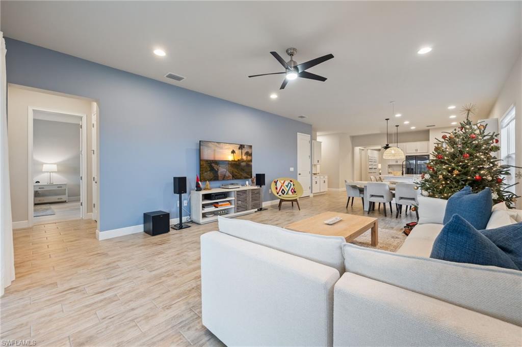 3509 Pilot Circle Naples, FL 34120 - Photo 19 of 50 a living room with furniture and a flat screen tv