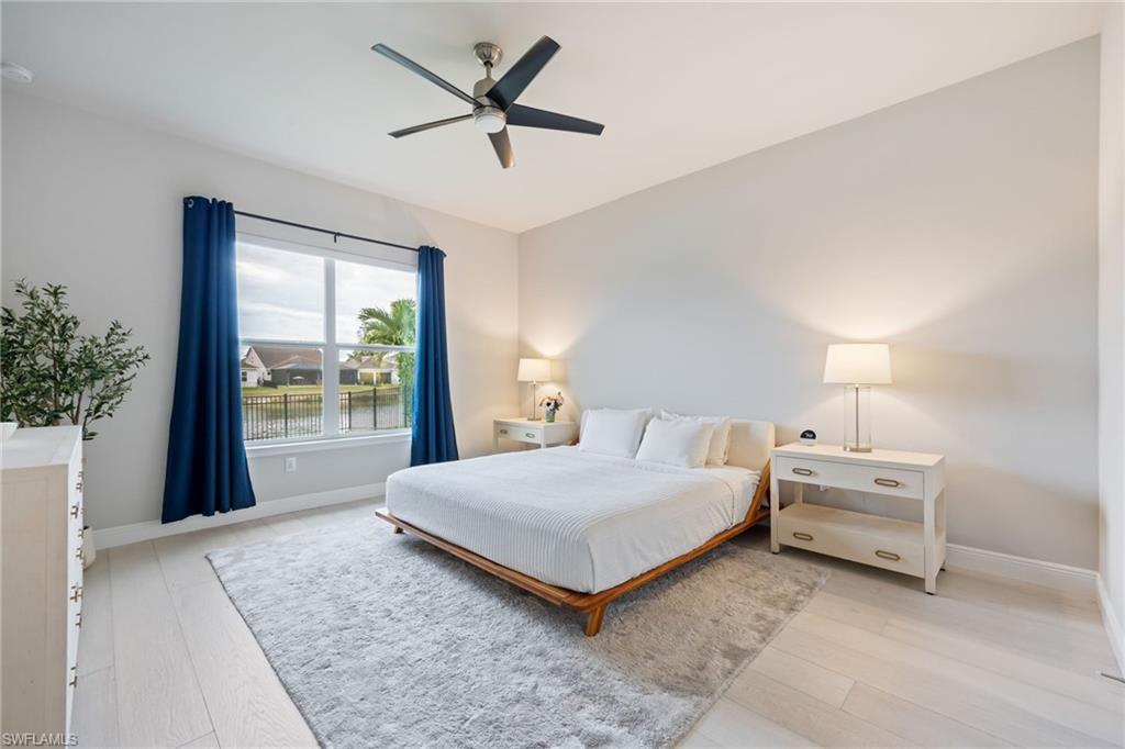 3509 Pilot Circle Naples, FL 34120 - Photo 21 of 50 a bedroom with a large bed and a large window