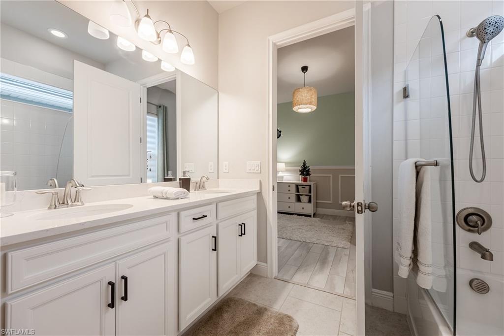 3509 Pilot Circle Naples, FL 34120 - Photo 27 of 50 a spacious bathroom with a double vanity sink mirror and shower