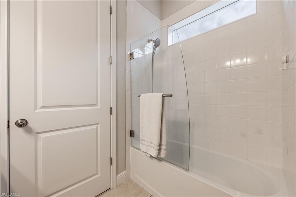 3509 Pilot Circle Naples, FL 34120 - Photo 28 of 50 a bathroom with a bathtub and a shower