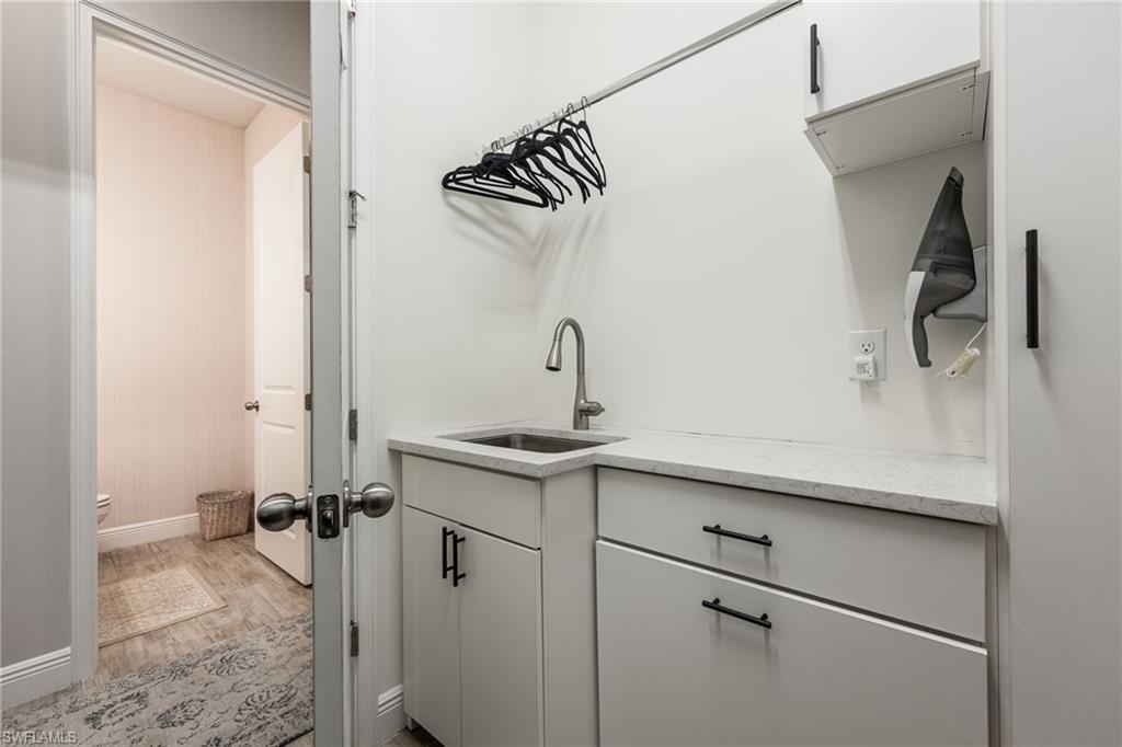 3509 Pilot Circle Naples, FL 34120 - Photo 33 of 50 a bathroom with a sink and mirror