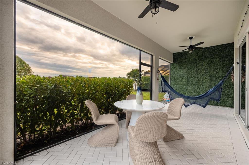 3509 Pilot Circle Naples, FL 34120 - Photo 34 of 50 a balcony with table and chairs