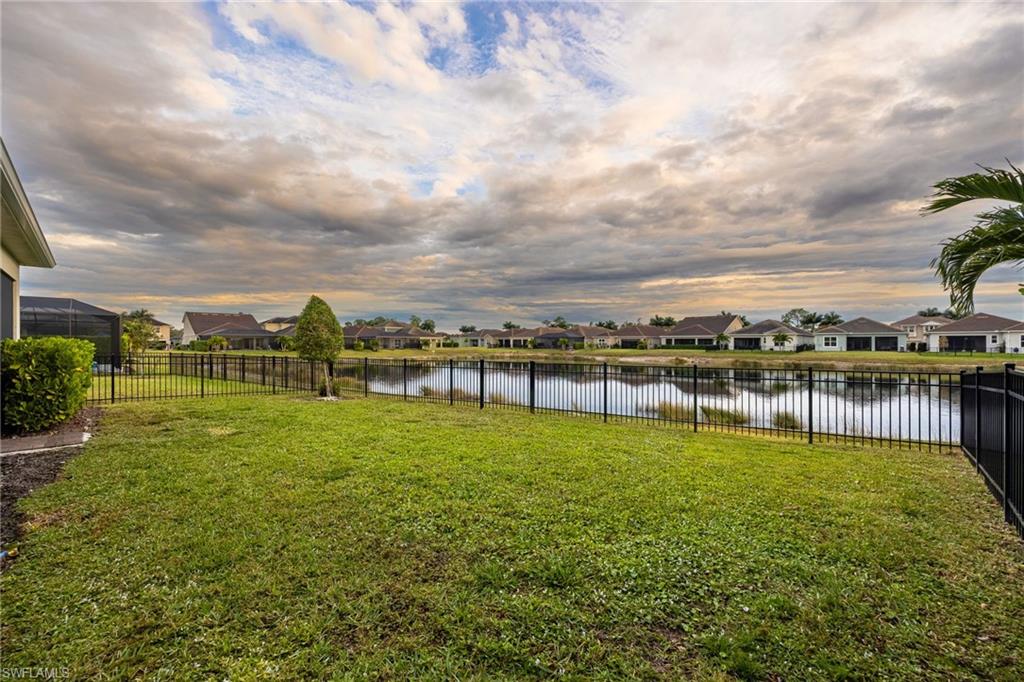 3509 Pilot Circle Naples, FL 34120 - Photo 37 of 50 a view of a lake with a big yard