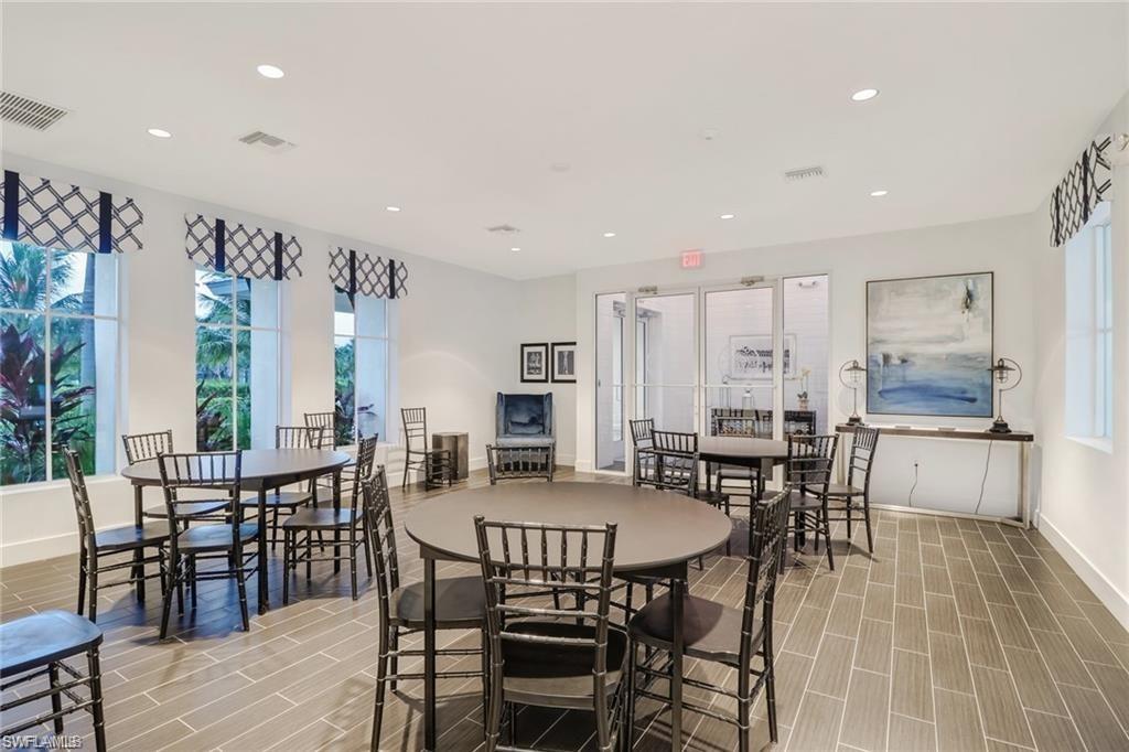 3509 Pilot Circle Naples, FL 34120 - Photo 49 of 50 a view of a a dining room with furniture window and wooden floor
