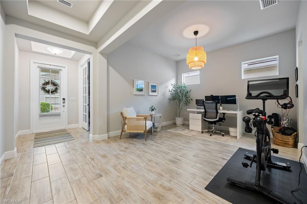 3509 Pilot Circle Naples, FL 34120 - Photo 6 of 50 a view of a livingroom with furniture and a workspace