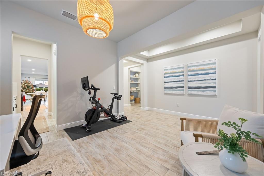3509 Pilot Circle Naples, FL 34120 - Photo 7 of 50 a view of a room with gym equipment