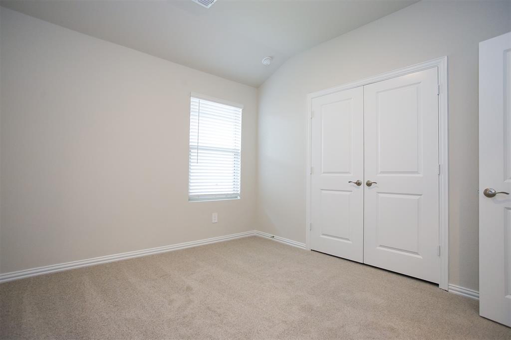 404 Castle Road Sherman, TX 75092 - Photo 14 of 25 an empty room with a window