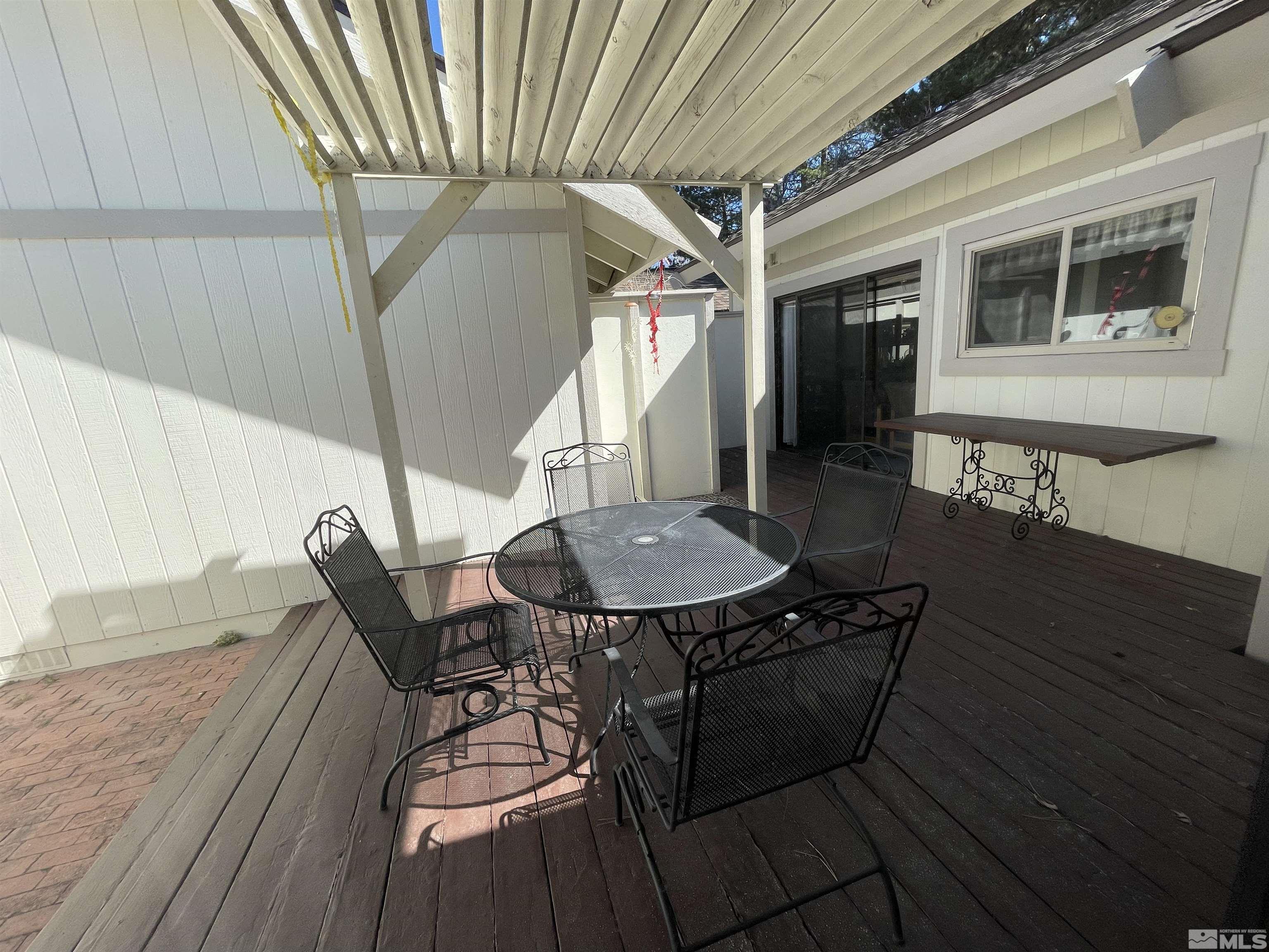 1234 Conway Lane Reno, NV 89503 - Photo 8 of 11 a backyard of a house with table and chairs