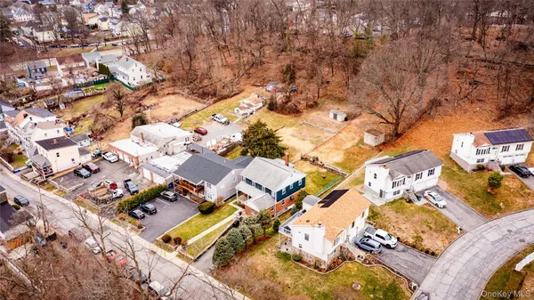 a view of yard with wooden fence and trees