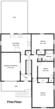a living room with a couch and a dining table with wooden floor