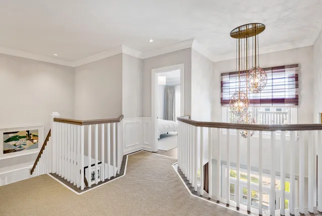 a bedroom with furniture and a chandelier