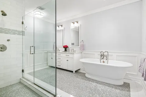 a white bath tub sitting in a bathroom