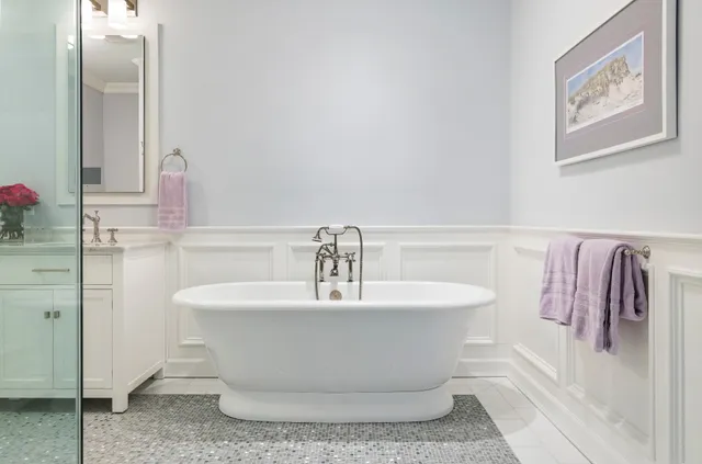 a bedroom with a bed and glass window