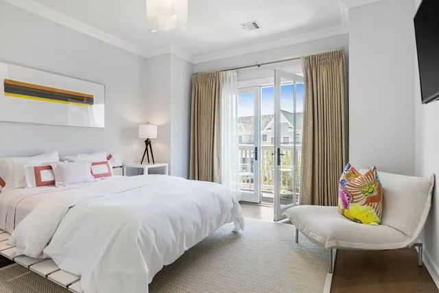 a bedroom with two beds and a large window