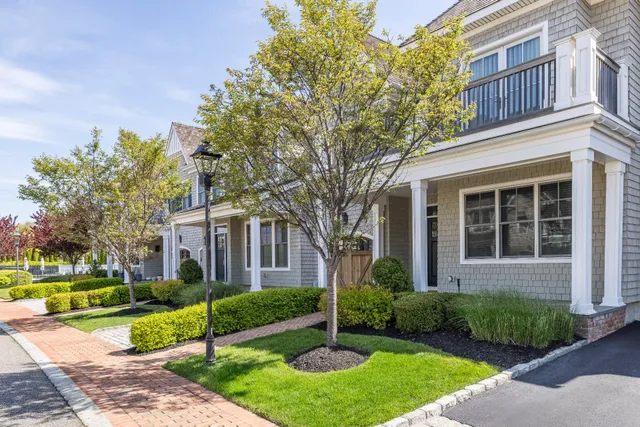 a view of a house with backyard porch and sitting area