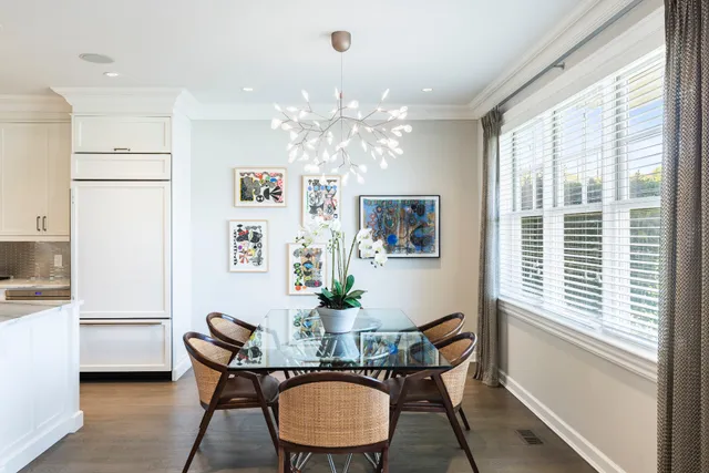 a kitchen with stove a sink and cabinets