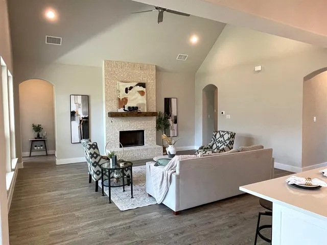 a living room with furniture and a fireplace