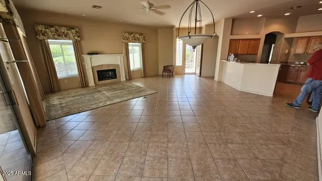 a view of livingroom with kitchen and fireplace