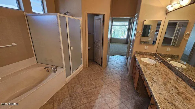 a bathroom with a tub and a shower