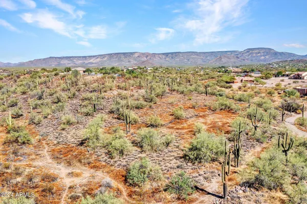 a view of a city with mountains in the background