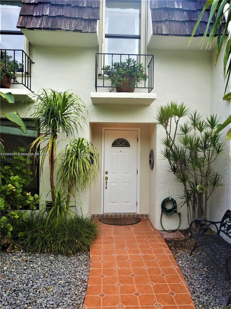9807 Southwest 93rd Street, Unit 9807 Miami, FL 33176 - Photo 2 of 50 a house view with a outdoor space