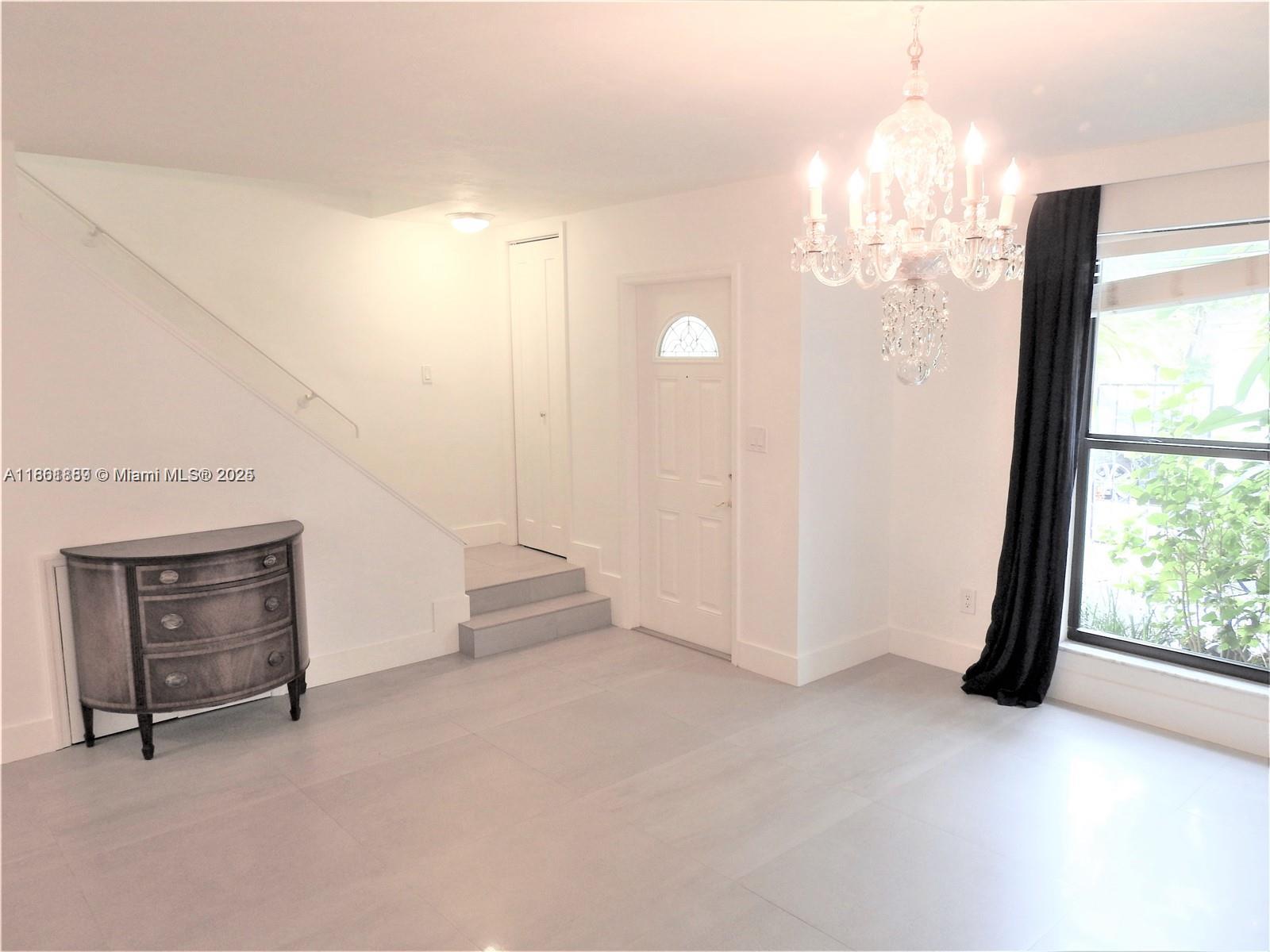 9807 Southwest 93rd Street, Unit 9807 Miami, FL 33176 - Photo 24 of 50 a view of an empty room with a window