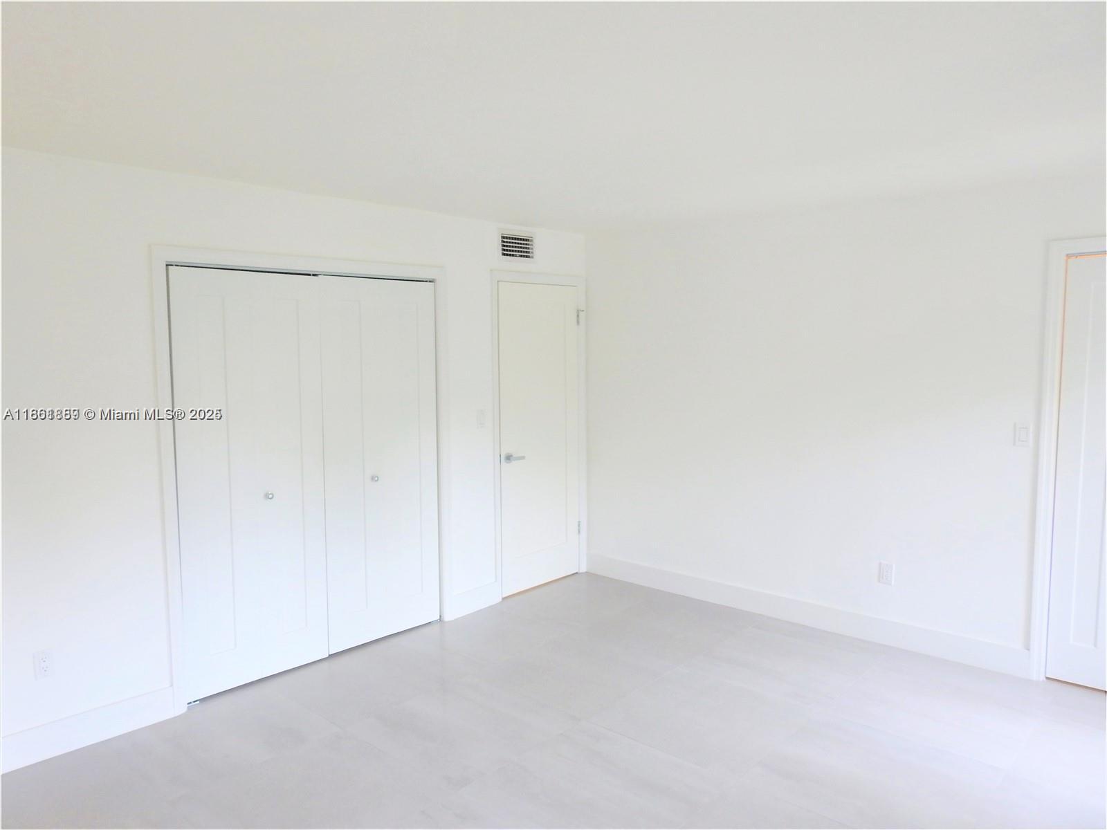 9807 Southwest 93rd Street, Unit 9807 Miami, FL 33176 - Photo 30 of 50 a view of an empty room