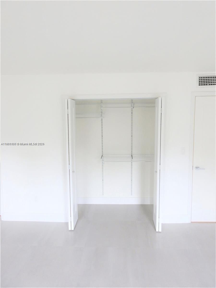 9807 Southwest 93rd Street, Unit 9807 Miami, FL 33176 - Photo 34 of 50 a view of an empty room