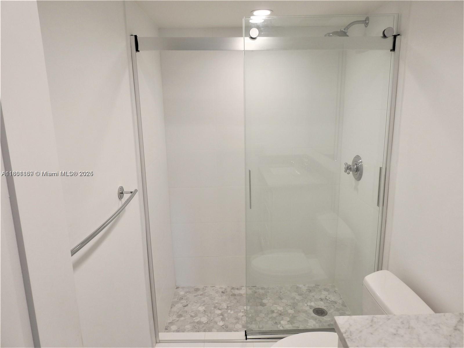 9807 Southwest 93rd Street, Unit 9807 Miami, FL 33176 - Photo 39 of 50 a bathroom with a shower