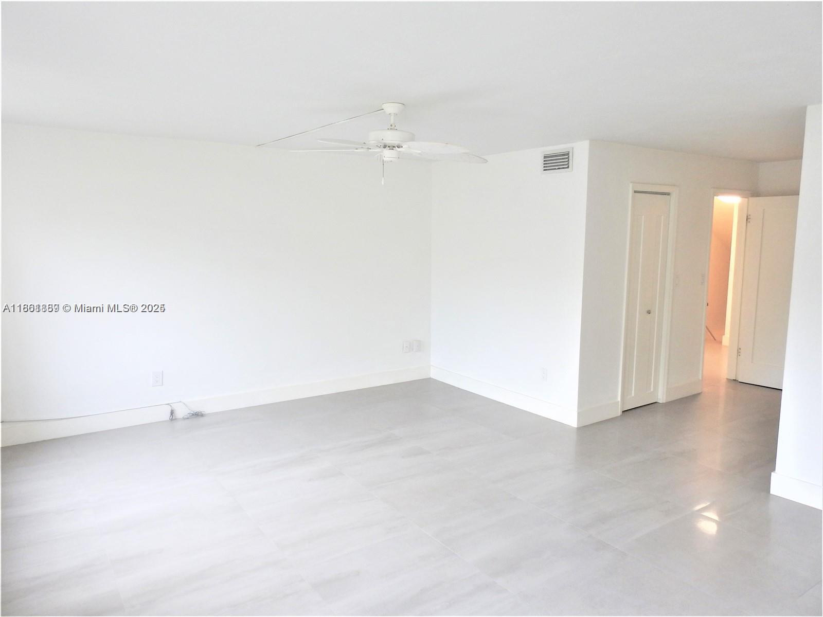 9807 Southwest 93rd Street, Unit 9807 Miami, FL 33176 - Photo 41 of 50 an empty room with an empty space