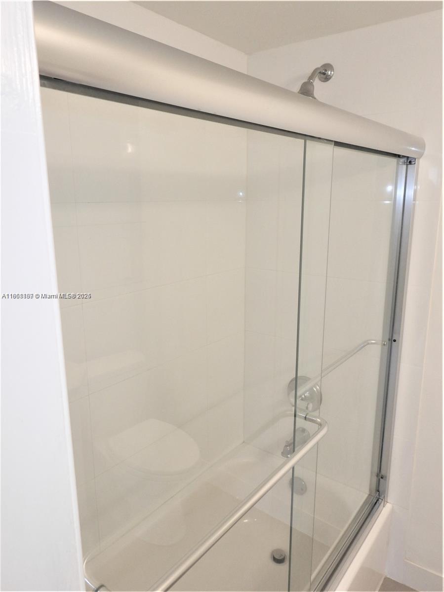 9807 Southwest 93rd Street, Unit 9807 Miami, FL 33176 - Photo 44 of 50 a bathroom with a shower