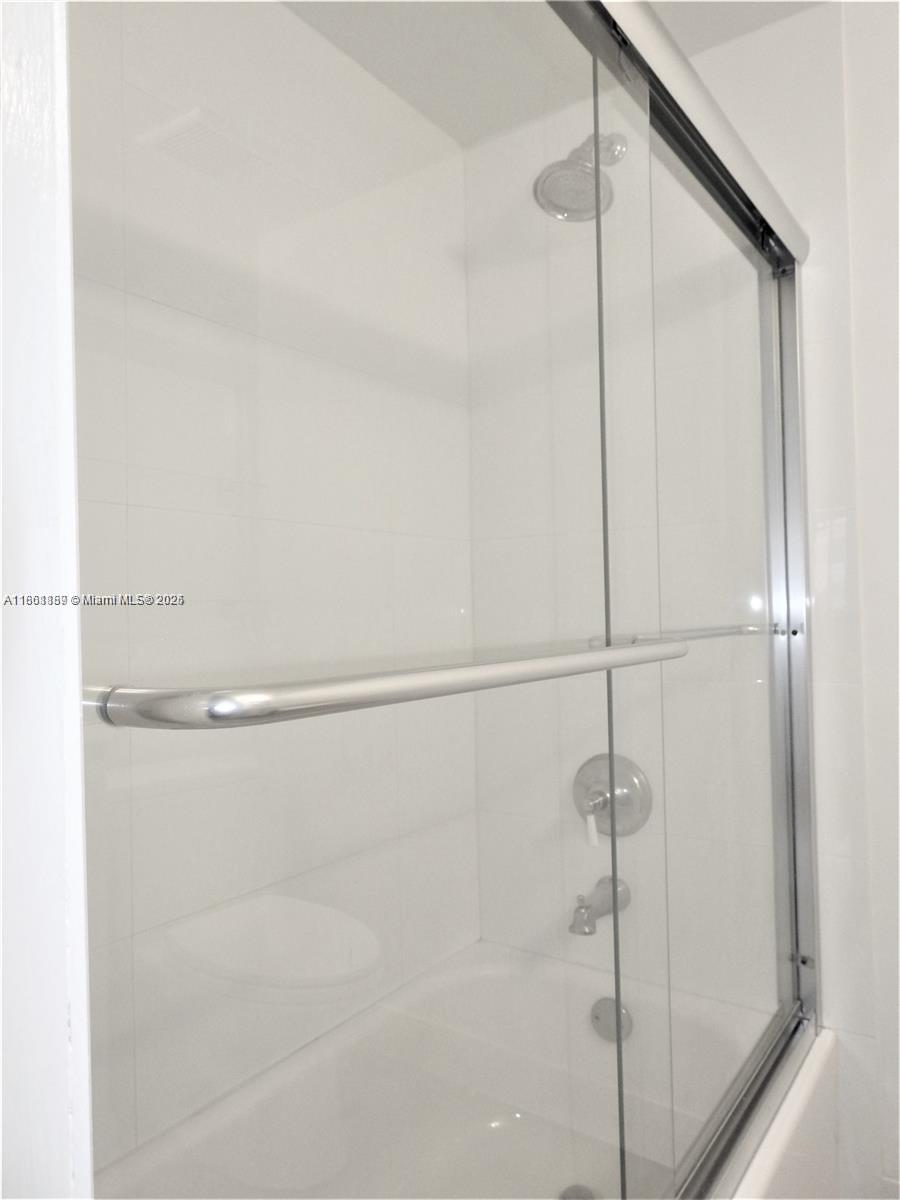 9807 Southwest 93rd Street, Unit 9807 Miami, FL 33176 - Photo 45 of 50 a bathroom with a shower