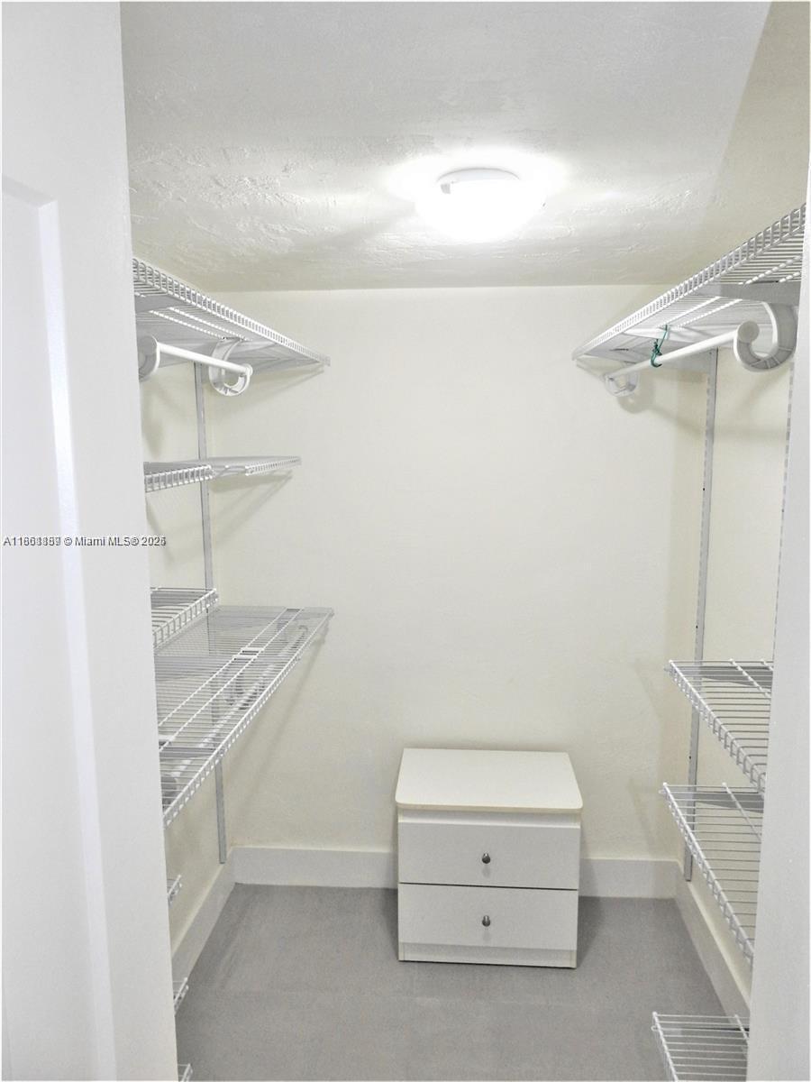 9807 Southwest 93rd Street, Unit 9807 Miami, FL 33176 - Photo 50 of 50 a bathroom with a sink a toilet and shower